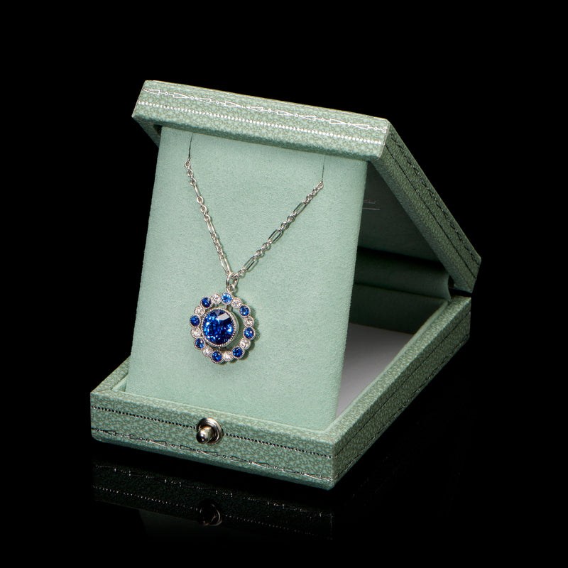 One & Sixteen A sapphire and diamond pendant