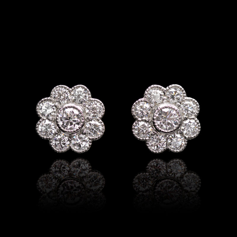 A pair of charming Auricula floral diamond cluster earrings