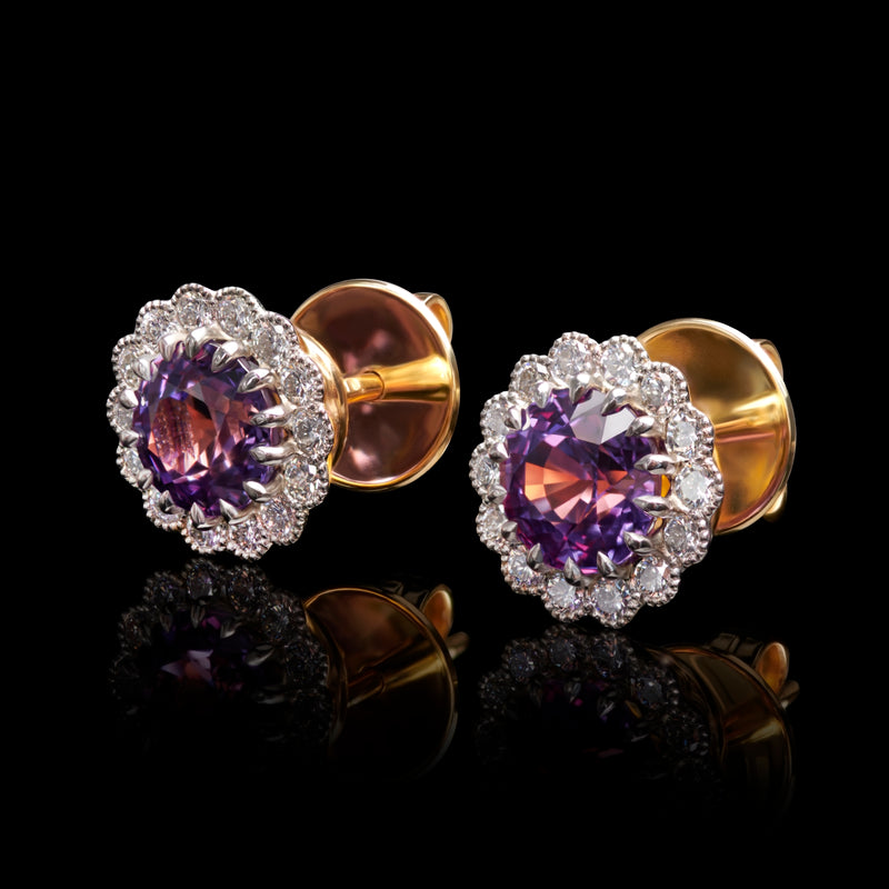 A unique pair of violet sapphire & diamond cluster earrings