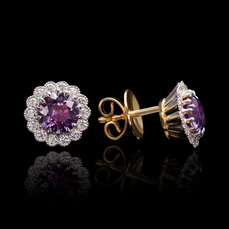 A unique pair of violet sapphire & diamond cluster earrings