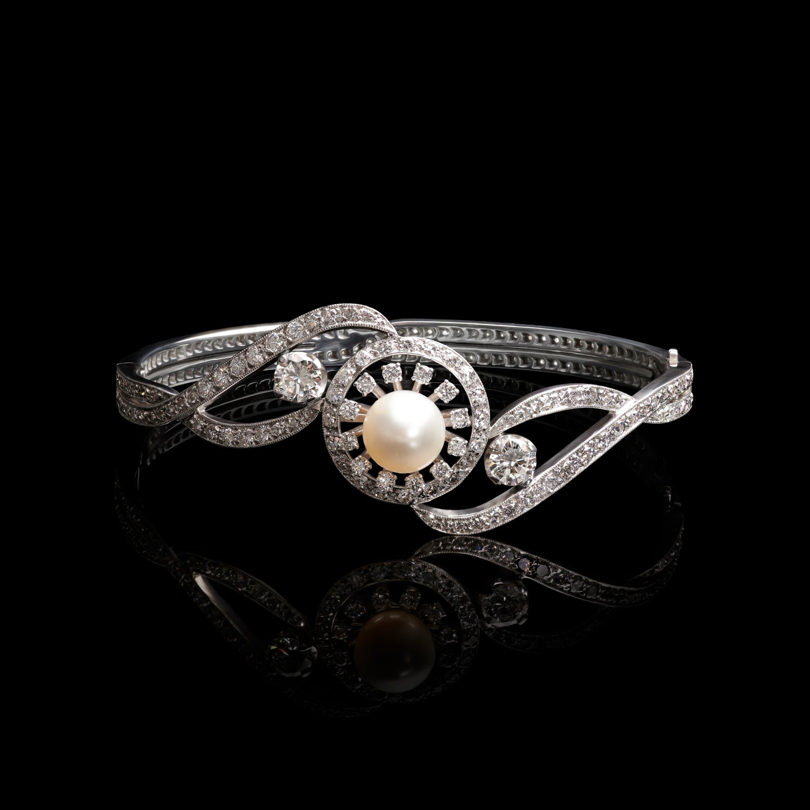 A natural pearl & diamond bangle