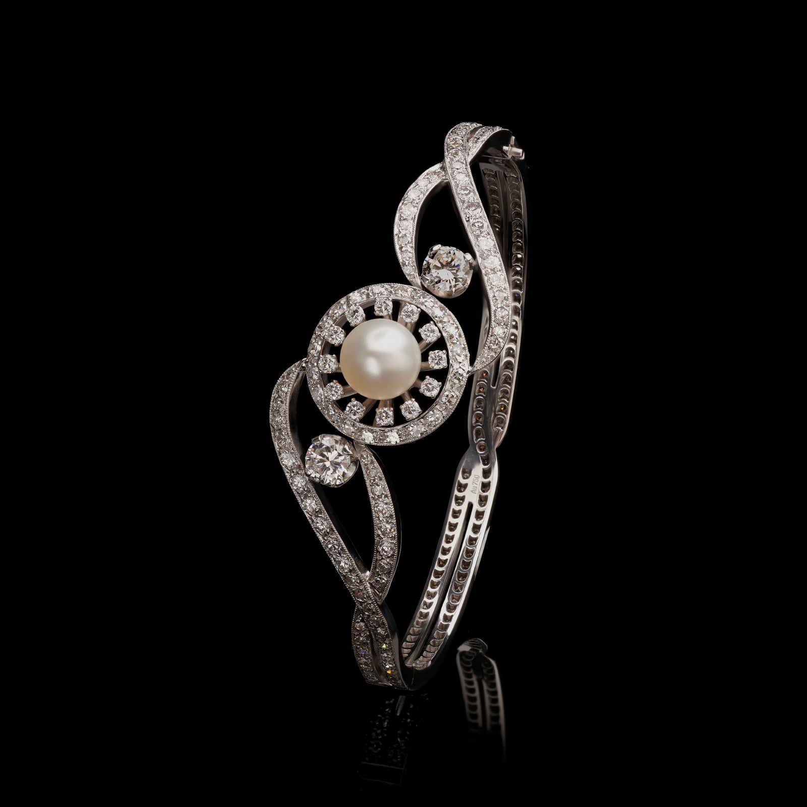 A natural pearl & diamond bangle