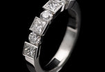 A Diamond Seven Stone Half Hoop Ring