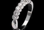A Classically Elegant Seven Stone Diamond Half Hoop Eternity Ring