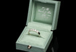 A Diamond Five Stone Half Hoop Half Eternity Ring with Scalloped Edge Settings