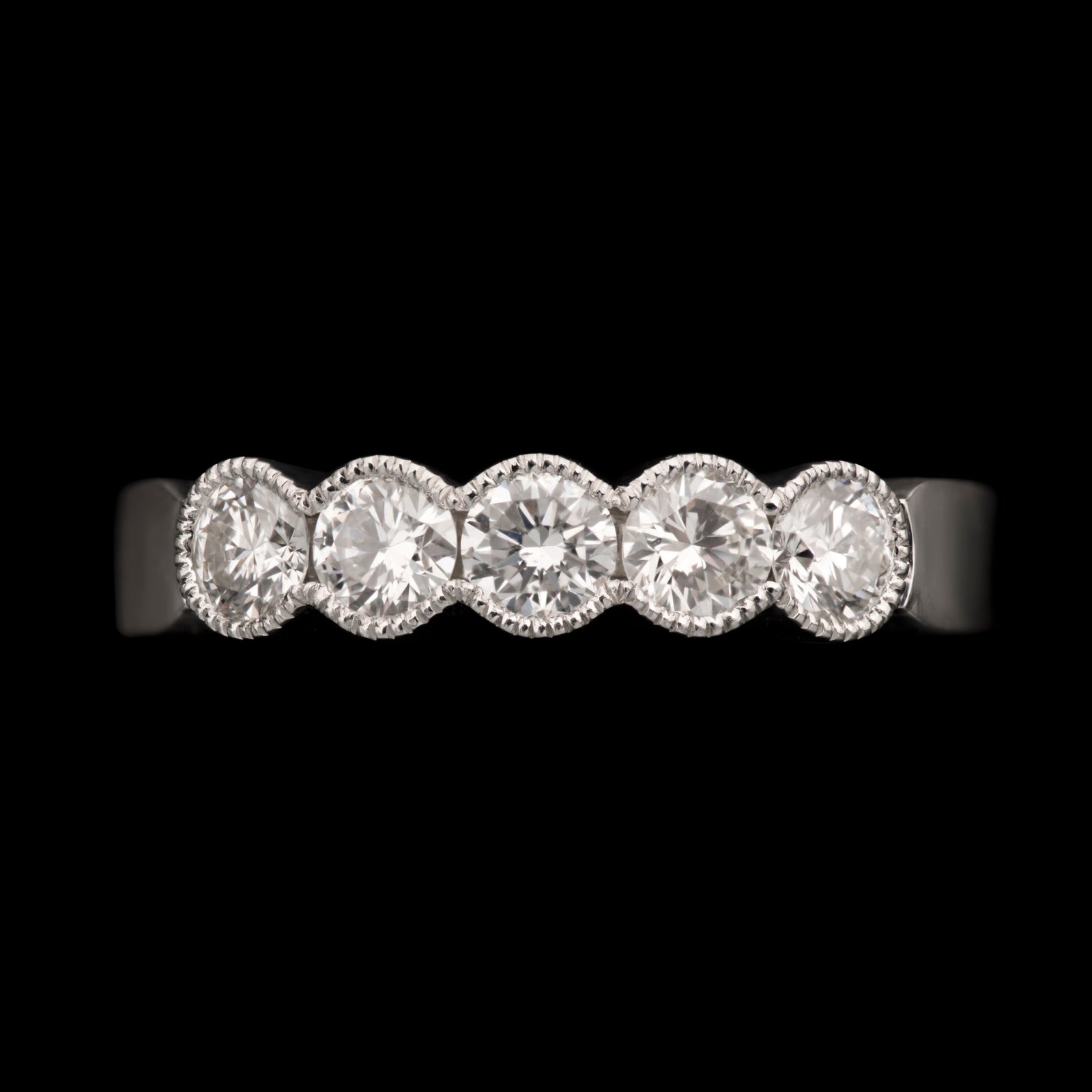 A Diamond Five Stone Half Hoop Half Eternity Ring with Scalloped Edge Settings