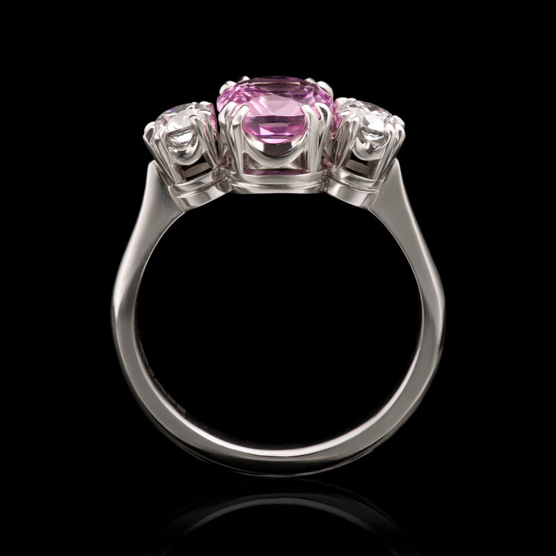 A glorious pink sapphire & diamond three stone ring