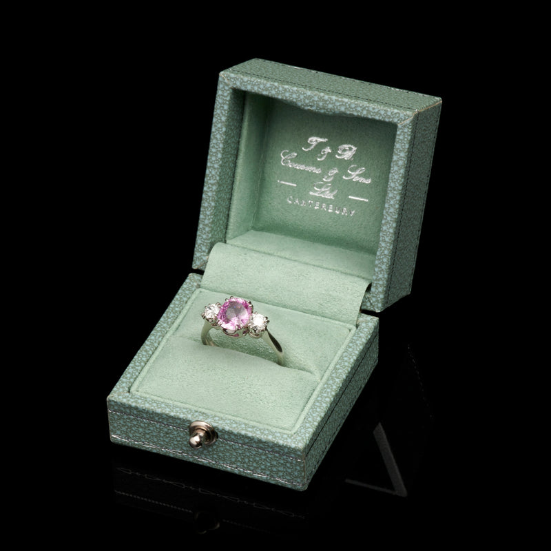 A glorious pink sapphire & diamond three stone ring