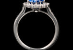 An exquisite oval sapphire & diamond cluster ring