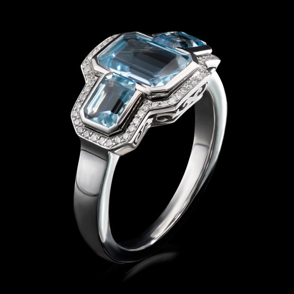 An Aquamarine Triple Cluster Half Hoop Ring