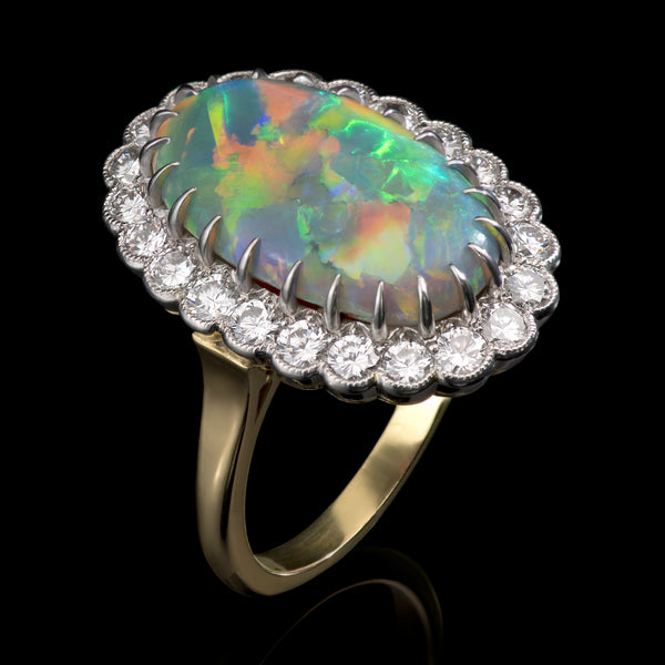 An Exceptional Quality Oval Opal & Diamond Cluster Ring