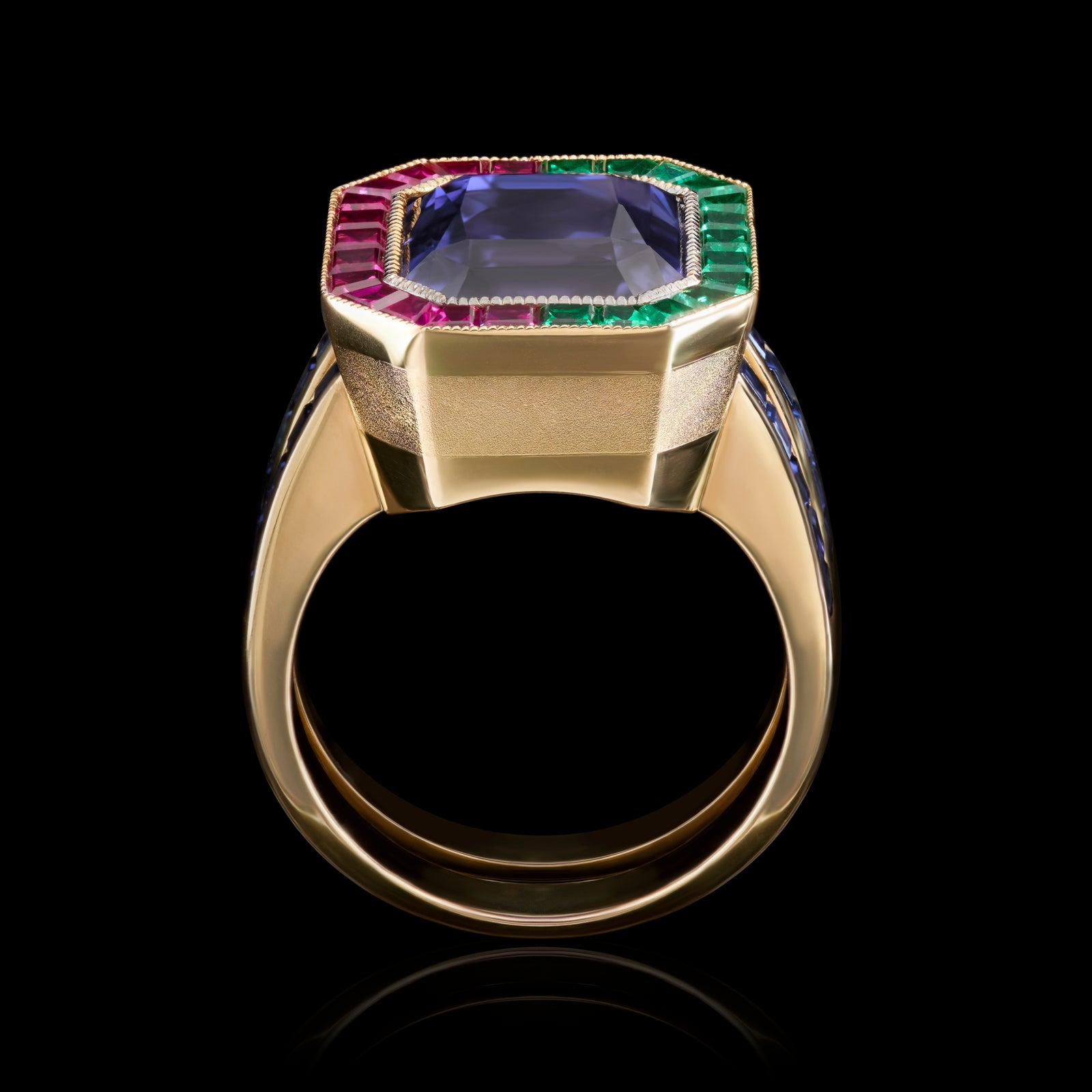 A Unique & Individual colour change Sapphire Ring with Emerald & Ruby surround.