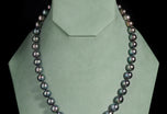 A most striking Tahitian Pearl Matinee Length Necklet with a Diamond Clasp
