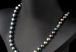 A most striking Tahitian Pearl Matinee Length Necklet with a Diamond Clasp