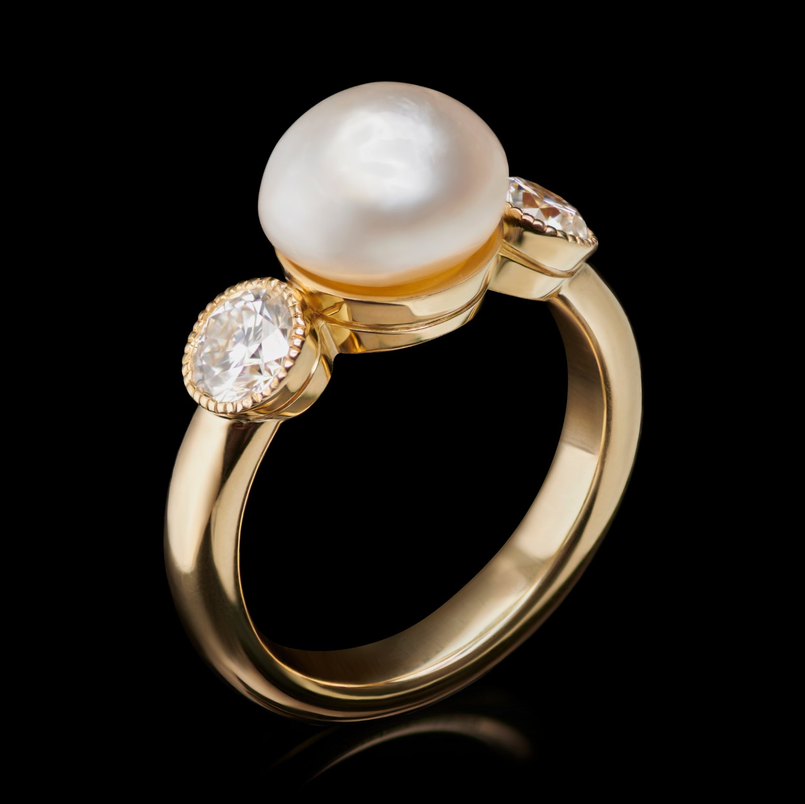 A Unique Natural Pearl & Diamond Three stone Ring