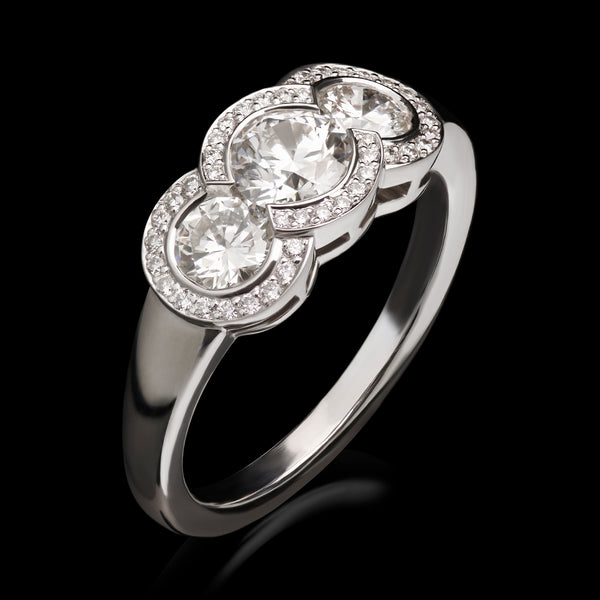An all brilliant cut diamond triple cluster ring