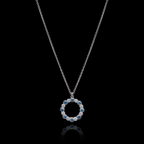 An Aquamarine & Diamond Circlet of Sixteen Pendant