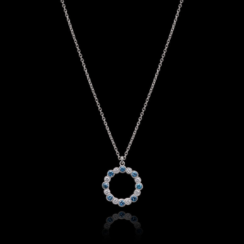 An Aquamarine & Diamond Circlet of Sixteen Pendant