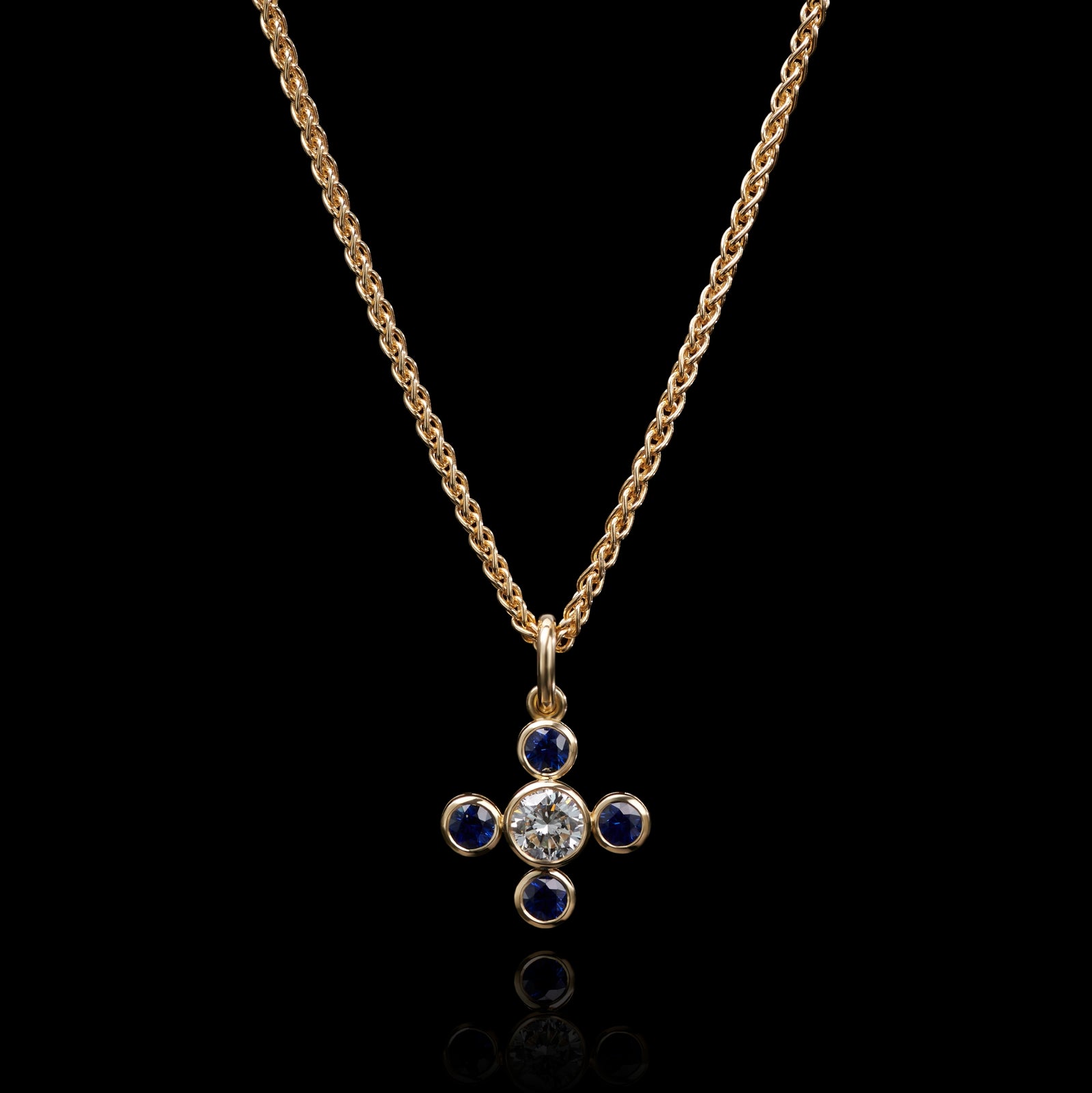 An amazing Sapphire Quatrefoil pendant with bold single stone Diamond centre