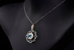 An Antique Aquamarine & Diamond Circlet Cluster Pendant