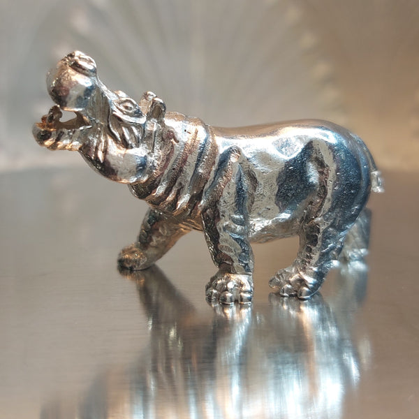 A large silver hippo model
